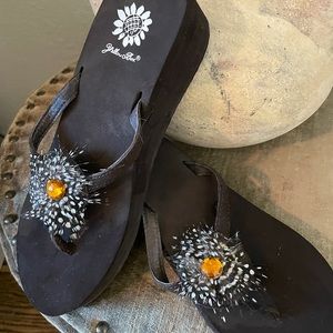 Woman’s brown yellow box flip flop